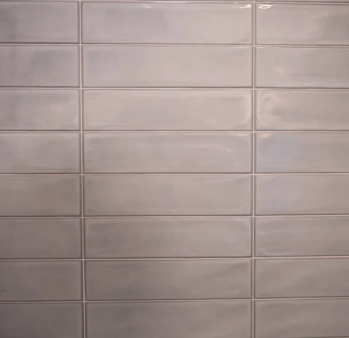 Close view of the gray wall tile and grout lines