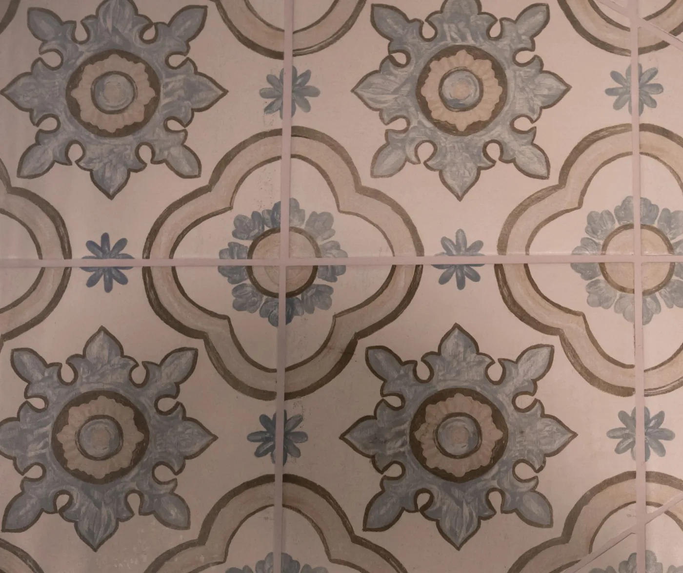 Patterned encaustic-look floor tile in blue and tan